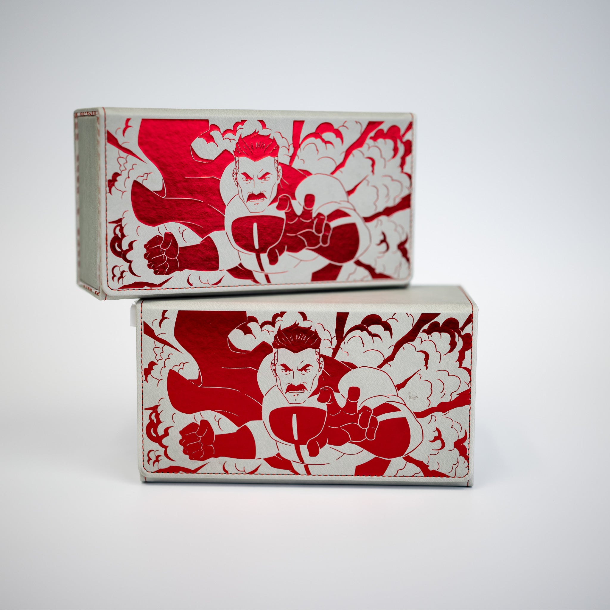 Two red and white boxes with a graphic design of a muscular figure on a gray background