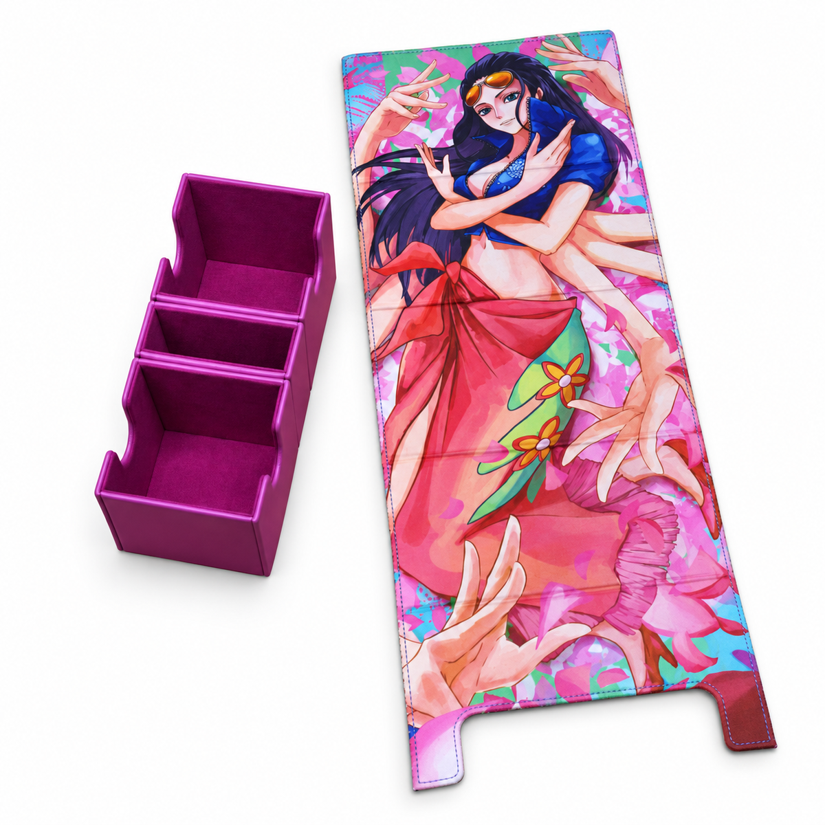 A rectangular anime-style printed mat or cover with a colorful illustration of a woman in blue and red clothing, shown next to a separate magenta three-compartment organizer on a plain white background.